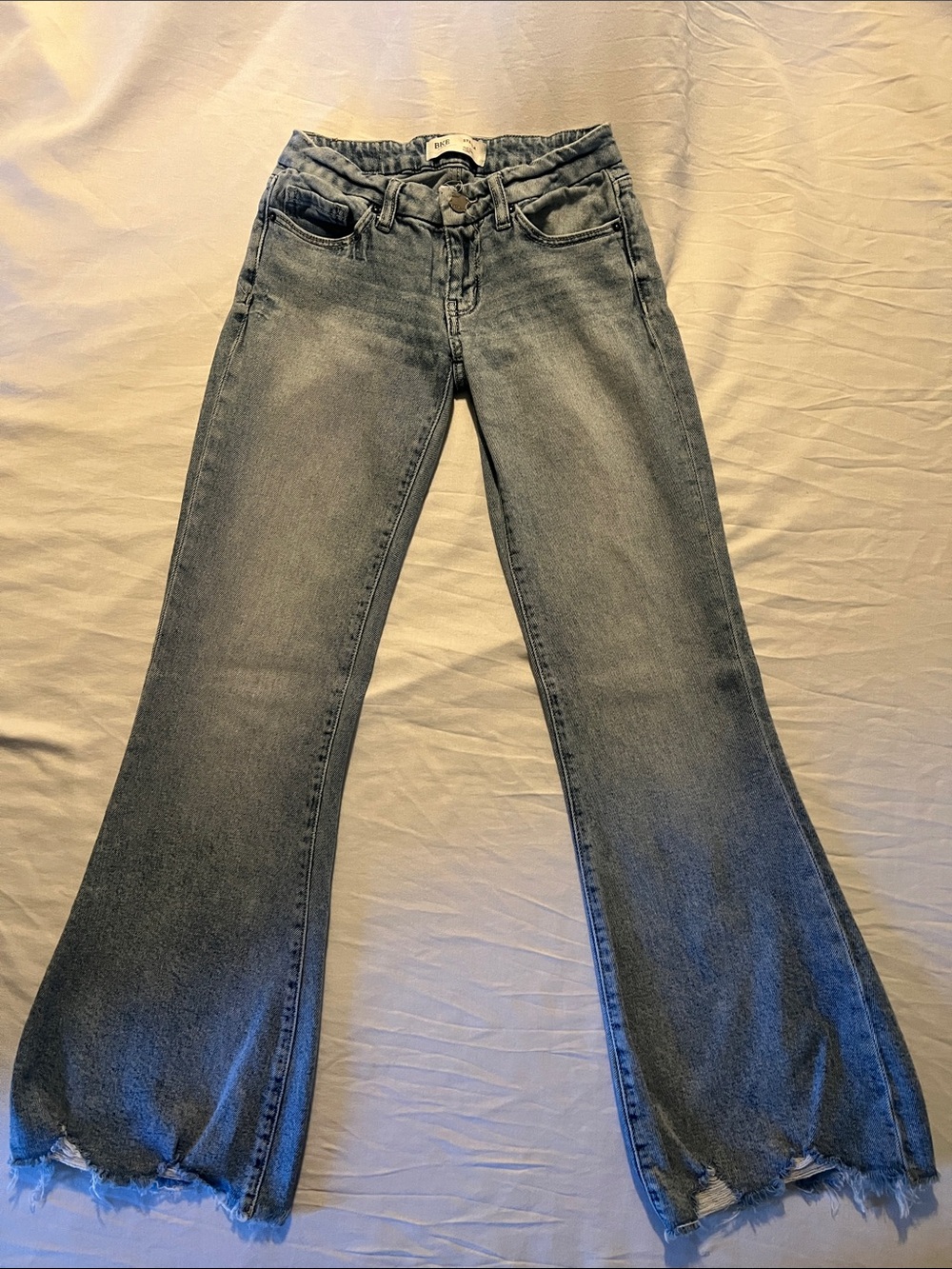 Buckle Gray Faded Flare Jeans with Raw Hem